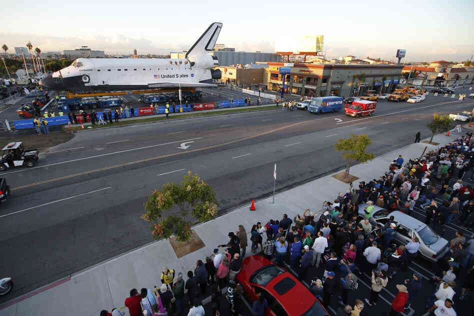 Spectators gather to watch the space shuttle Endeavour in Los Angeles on Friday. Endeavour's 12-mile road trip kicked off shortly before midnight Thursday as it moved from its Los Angeles International Airport hangar en route to the California Science Center, its ultimate destination.