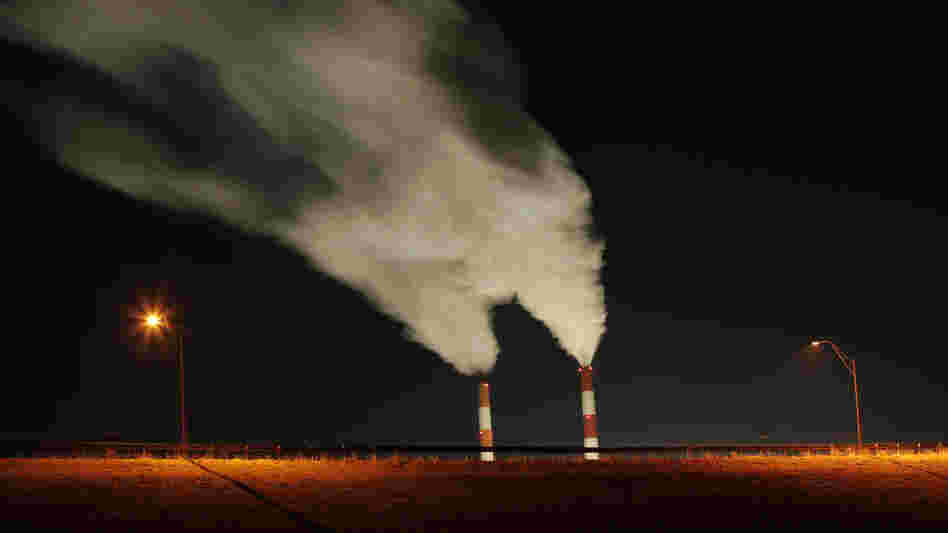 Smoke rises from the stacks of the La Cygne Generating Station coal-fired power plant in La Cygne, Kan. President Obama's regulation of the coal industry has come under fire from his Republican challenger, Mitt Romney.