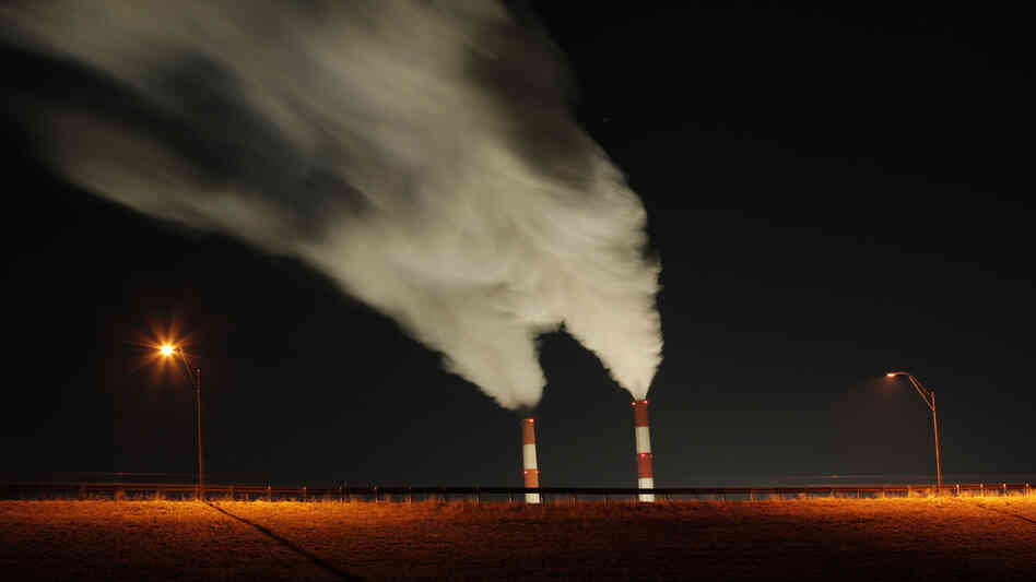 Smoke rises from the stacks of the La Cygne Generating Station coal-fired power plant in La Cygne, Kan. President Obama's regulation of the coal industry has come under fire from his Republican challenger, Mitt Romney.