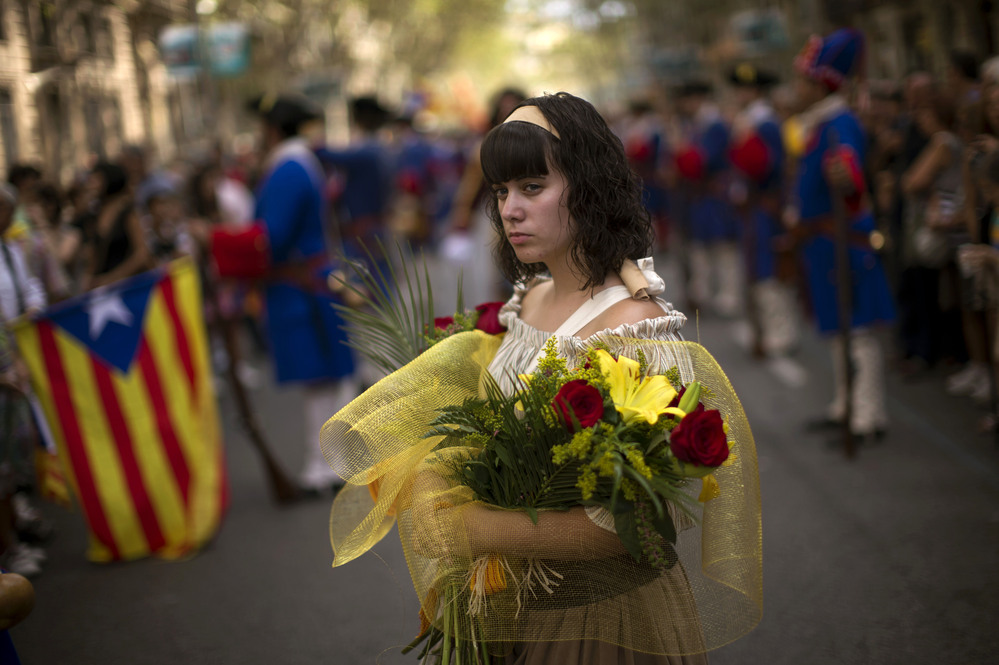 A woman in traditional Catalan dress participates in National Day demonstrations in Barcelona on Sept. 11.