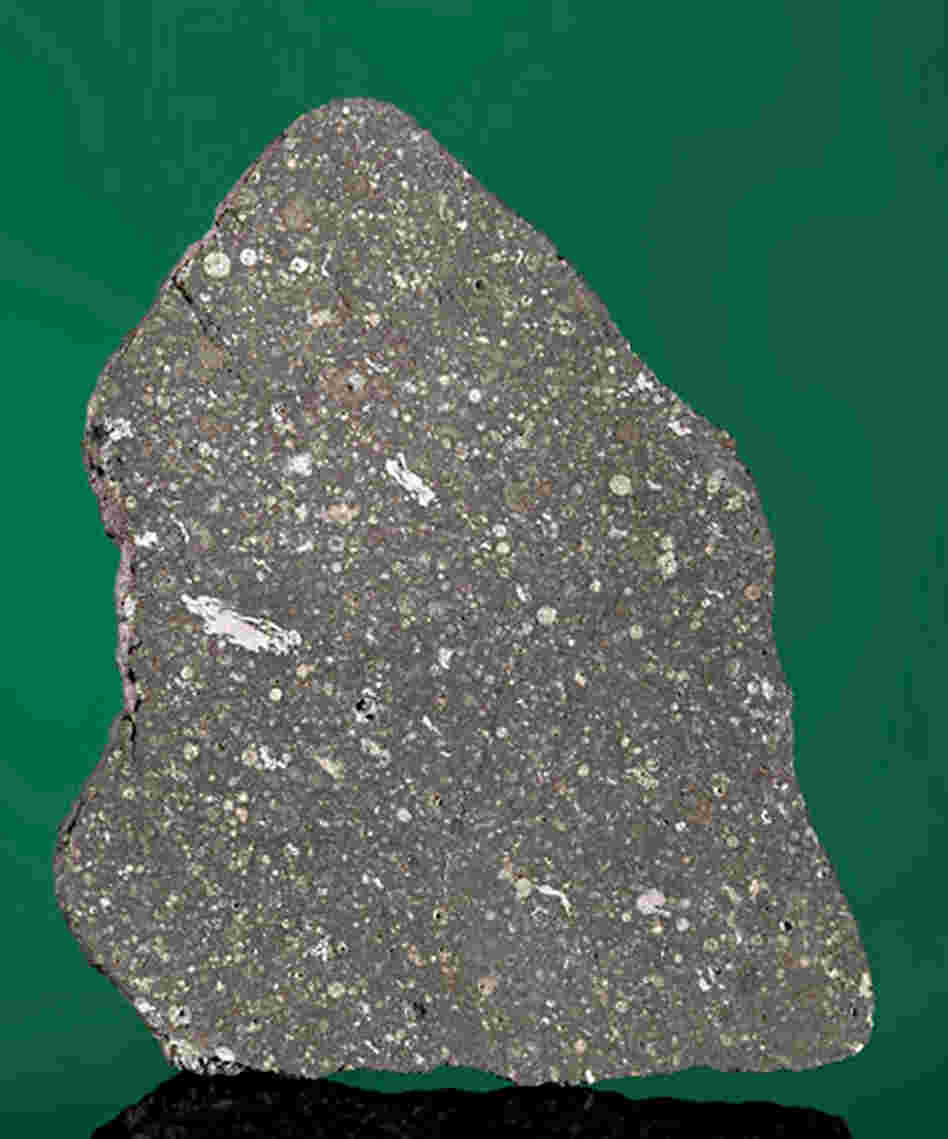 Touch Stardust: A slice of the Allende meteorite that fell in Chihuahua, Mexico, in 1969. It contains white calcium-aluminum inclusions, material present at the birth of our solar system. Touch Stardust: A slice of the Allende meteorite that fell in Chihuahua, Mexico, in 1969. It contains white calcium-aluminum inclusions, material present at the birth of our solar system.