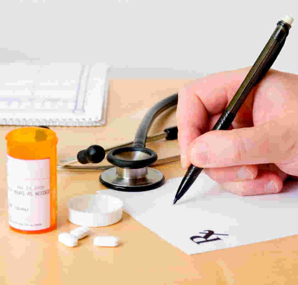 Doctor writing a prescription.