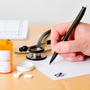 Doctor writing a prescription. Doctor writing a prescription.