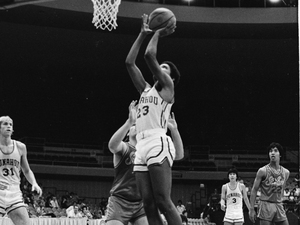 Obama shoots the ball while playing for the Punahou School basketball team in 1979.