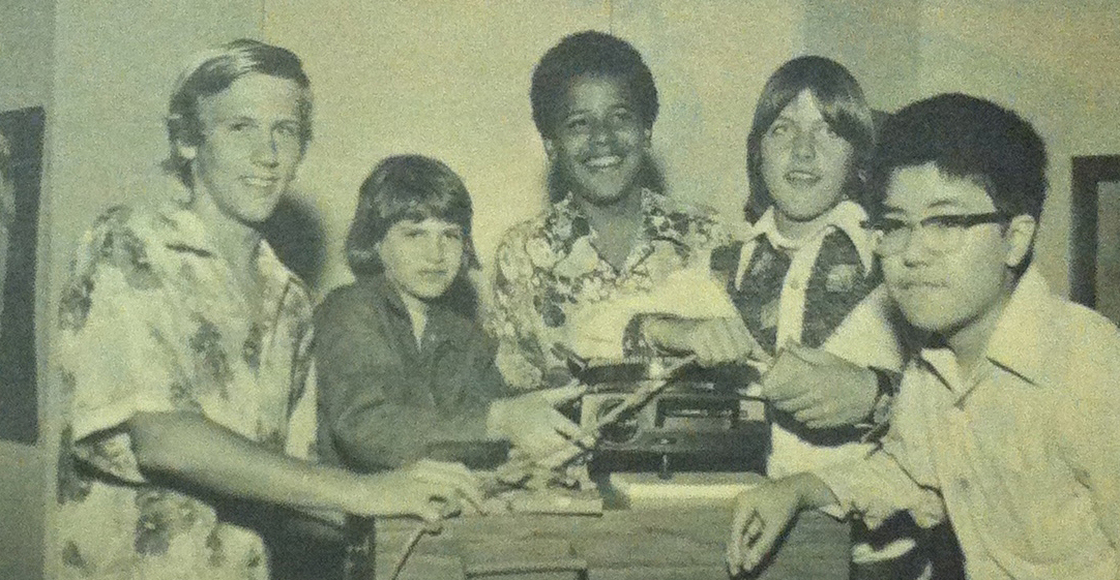 Barack Obama in a 1975 photo from the Punahou School yearbook. He and his eighth-grade homeroom classmates pose with a slide projector as part of the yearbook's theme of "Nostalgia."