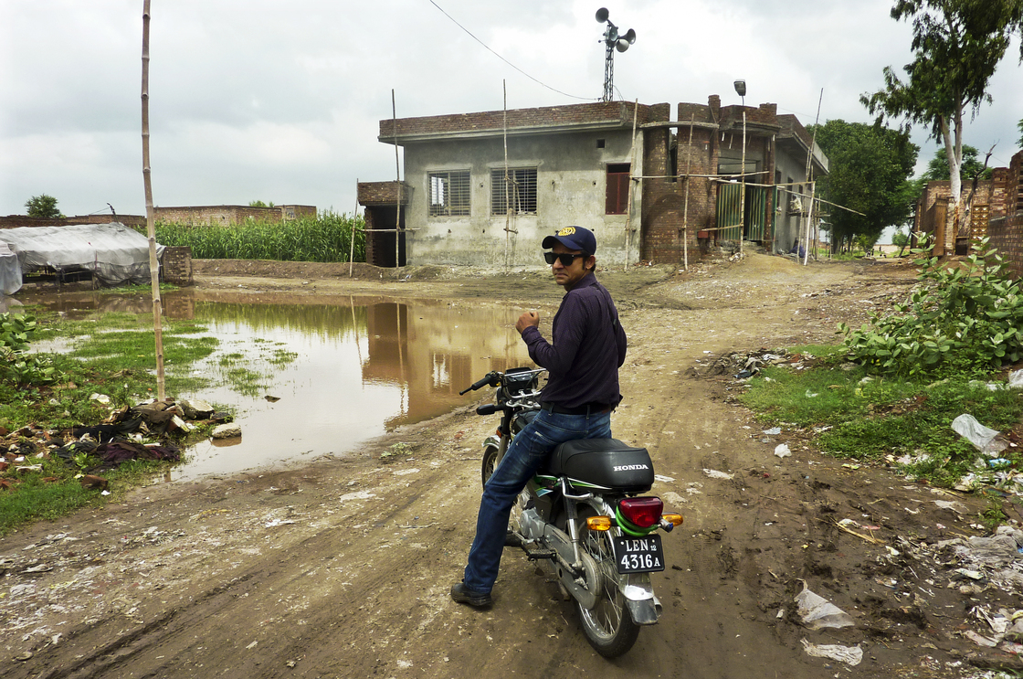 Social mobilizer Omer Feroze makes his way through a Lahore slum as part of an effort to educate people about polio and dispel any rumors about the vaccine. Misconceptions about the vaccine are rife within the country's population.