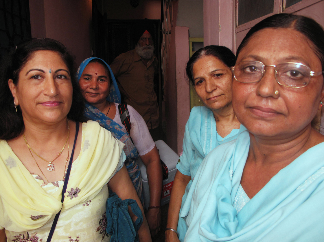 Dr. Kiran Kathuria (left) and veteran volunteer Santosh Sharma (front right) make the rounds with a team of vaccinators in Nehru Nagar, a middle-class area of Delhi. India's nationwide polio eradication program, begun in 1995, was modeled after Delhi's.