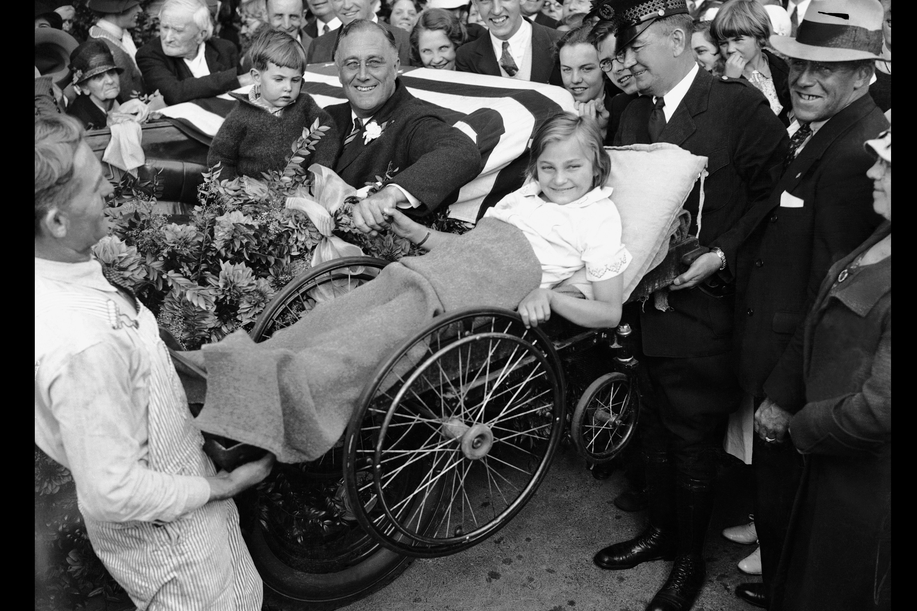 The vast majority of polio victims are children, but it can also strike adults. Franklin D. Roosevelt contracted polio in 1921 at age 39. Here, two men lift a little girl in a wheelchair so that Roosevelt can greet her from his vehicle during his first presidential campaign. The vast majority of polio victims are children, but it can also strike adults. Franklin D. Roosevelt contracted polio in 1921 at age 39. Here, two men lift a little girl in a wheelchair so that Roosevelt can greet her from his vehicle during his first presidential campaign.
