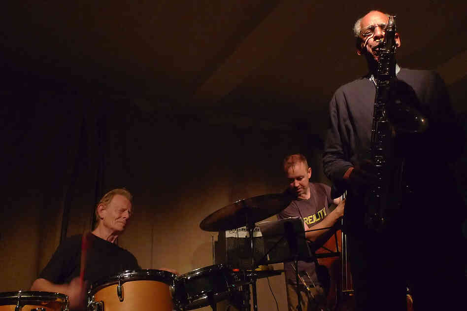The late John Tchicai (right) performs in London in 2010, with drummer Tony Marsh and bassist John Edwards.