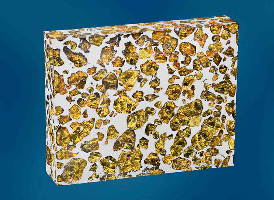 Good Enough To Eat? No, it's not nougat (though it does look a bit like the honey, sugar, egg white and nut confection). Those are olivine and peridot crystals suspended in a piece of the Fukang meteorite found in China's Gobi Desert. Estimated price: $100,000-$120,000.