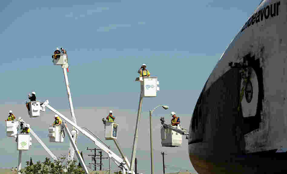 Having escaped out of Earth's atmosphere two dozen times, Endeavour's slow-speed trek Saturday to its retirement center took it through the working class streets of southern Los Angeles. 
