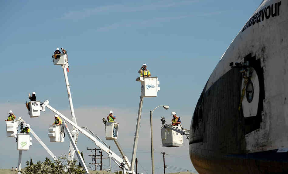 Having escaped out of Earth's atmosphere two dozen times, Endeavour's slow-speed trek Saturday to its retirement center took it through the working-class streets of southern Los Angeles.