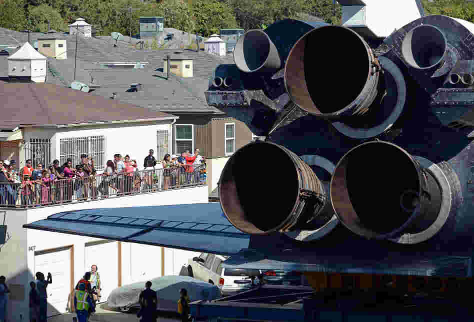 Along the 12-mile course, people marveled at the engineering. Some rooted for Endeavour when it appeared it might clip a lightpost. Others wondered if it could just hurry up to its destination. 