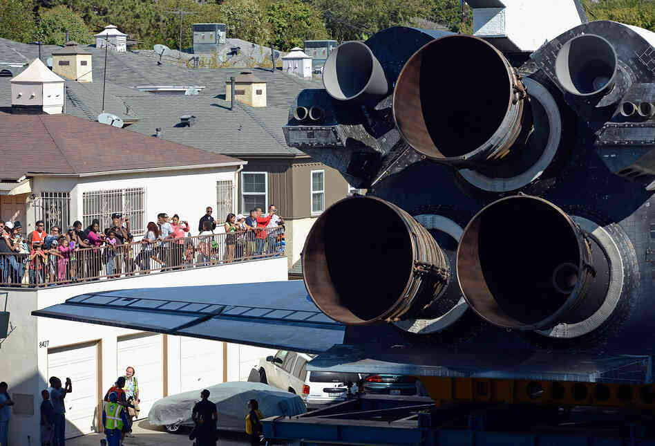 Along the 12-mile course, people marveled at the engineering. Some rooted for Endeavour when it appeared it might clip a lightpost. Others wondered if it could just hurry up to its destination. 