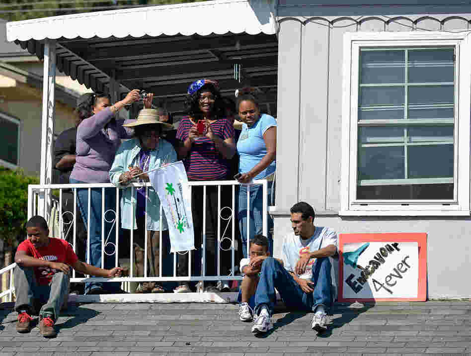 As it wound through South Los Angeles, on Saturday, residents welcomed its presence. Before the move, some lamented over the loss of shade as trees were chopped down to provide clearance.