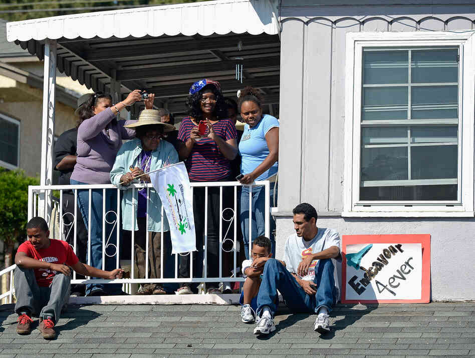 As it wound through South Los Angeles, residents welcomed its presence. Before the move, some lamented over the loss of shade as trees were chopped down to provide clearance.