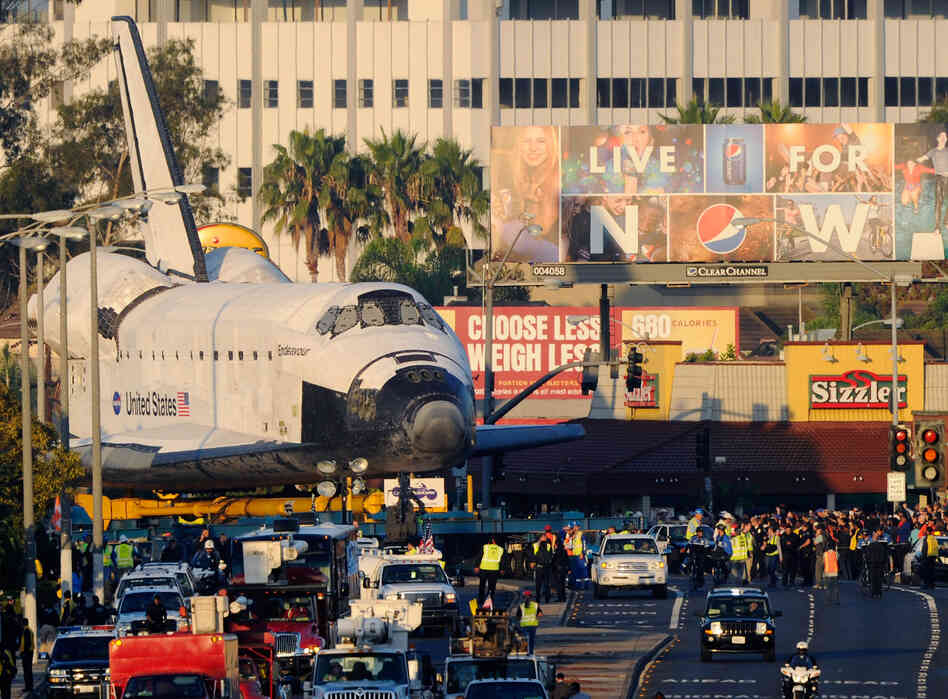 The shuttle could not be taken apart without damaging the delicate tiles. Airlifting it was out of the question, so was driving on freeways since it's too massive to fit through underpasses.
