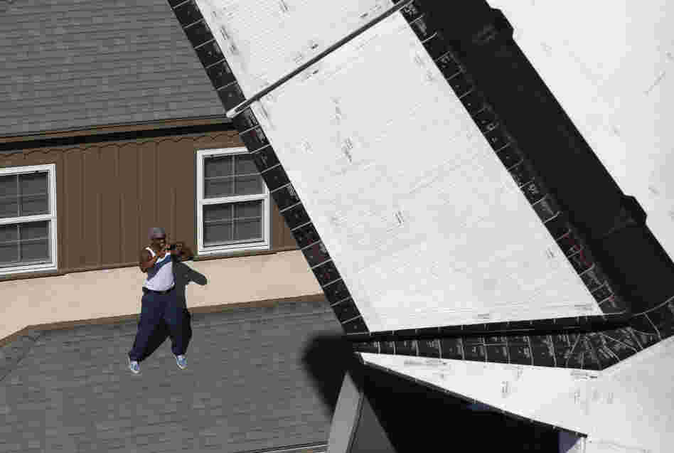 The one exception was when the shuttle poked through a slightly curved residential street lined with apartment buildings on both sides. It was such a squeeze that its 78-foot wingspan towered over driveways.