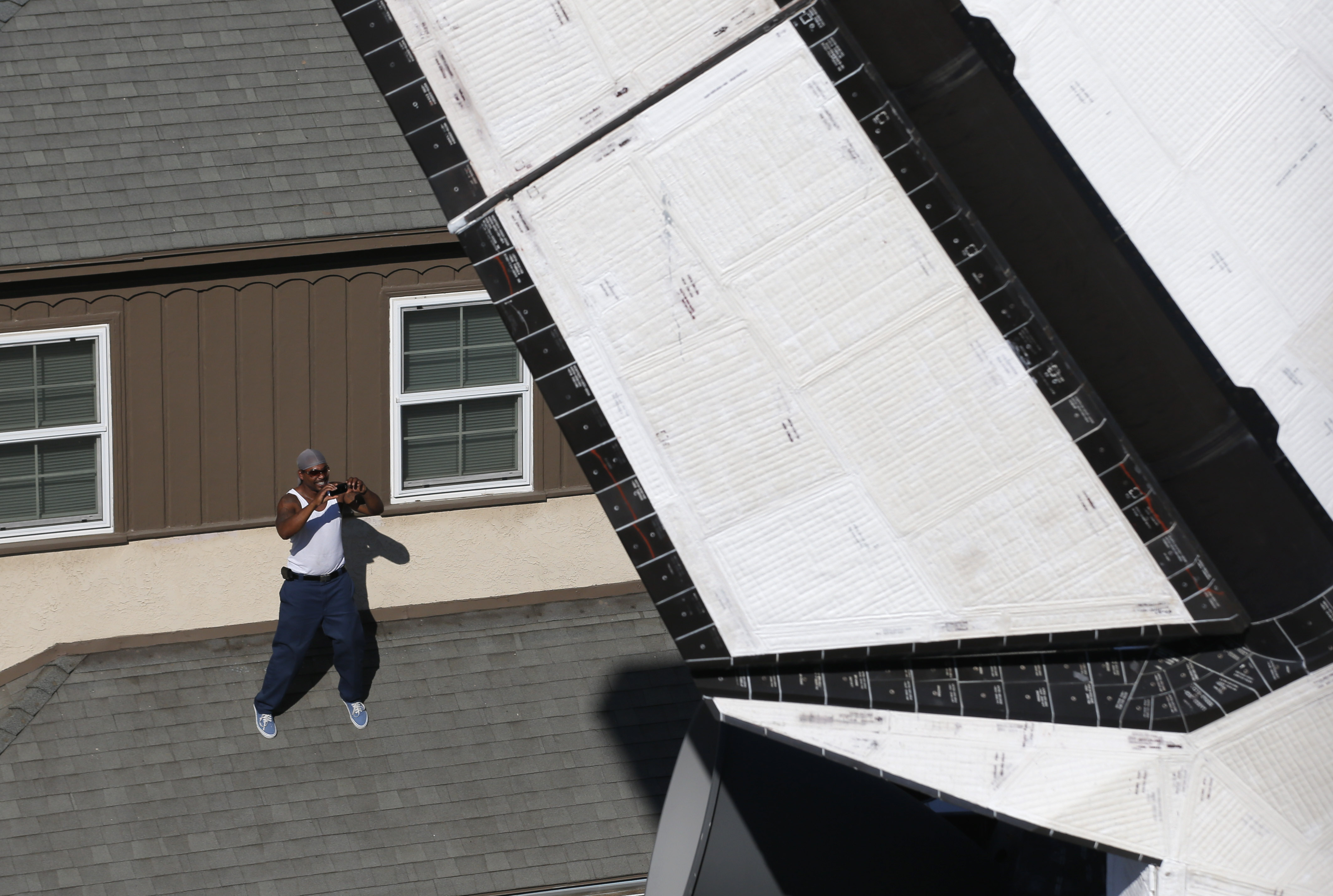 The one exception was when the shuttle poked through a slightly curved residential street lined with apartment buildings on both sides. It was such a squeeze that its 78-foot wingspan towered over driveways.
