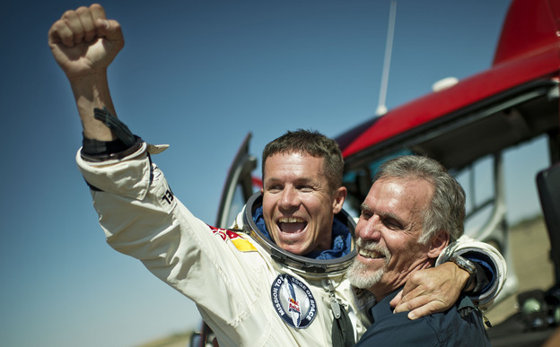 Pilot Felix Baumgartner of Austria and technical project director Art Thompson celebrate after Baumgartner completed a skydive from the stratosphere Sunday.