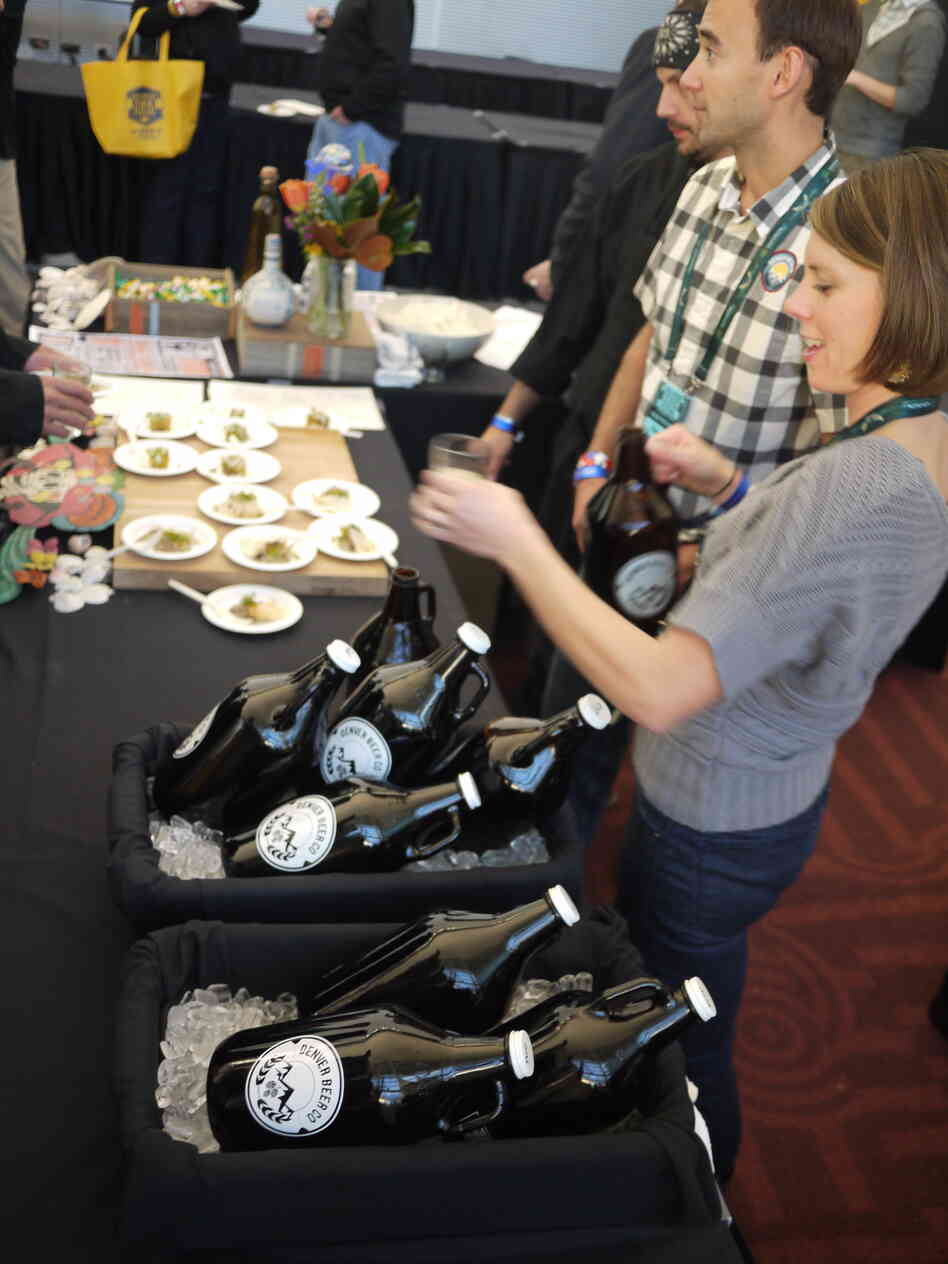 The Denver Beer Company's tasting table featured growlers of its pumpkin beer and graham cracker porter.