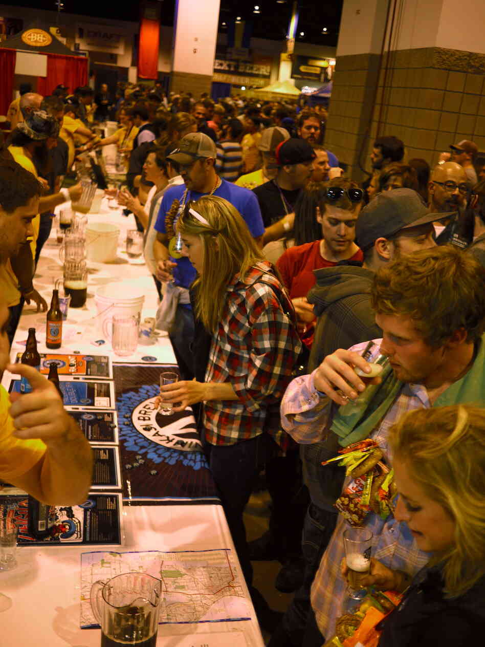 Served in one-ounce portions, beer is sniffed and tasted — and then replaced with another variety. Water and dump buckets help speed the process. Some 36,000 gallons of beer were brought to the festival.