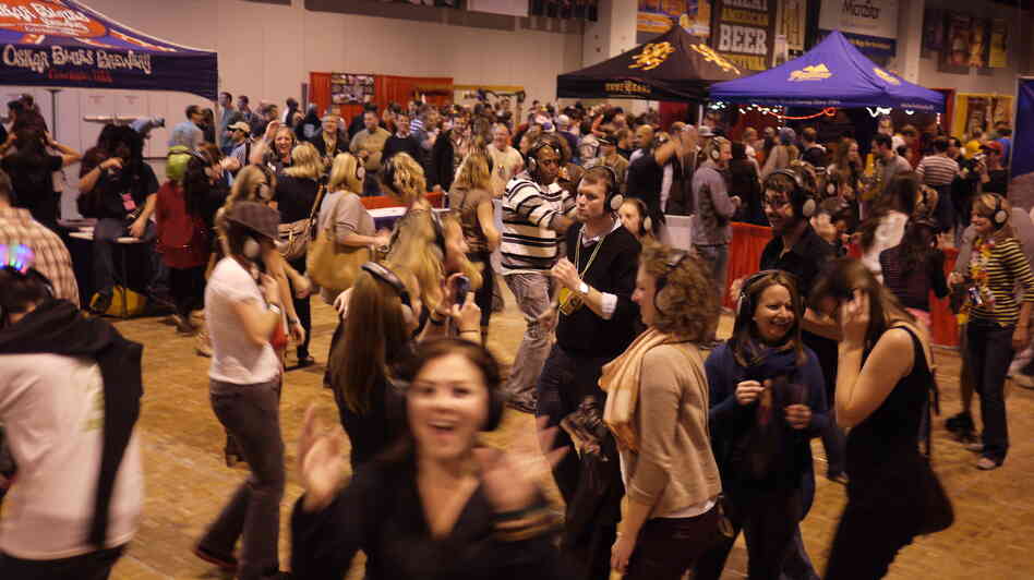 Taking a break from beer, festival attendees dance at a "Silent Disco" put on each year by Colorado brewery Oskar Blues.
