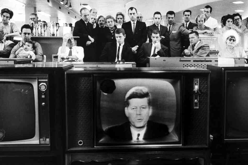 President John F. Kennedy gives his TV announcement of the Cuban blockade during the missile crisis in a department store in California in October 1962.
