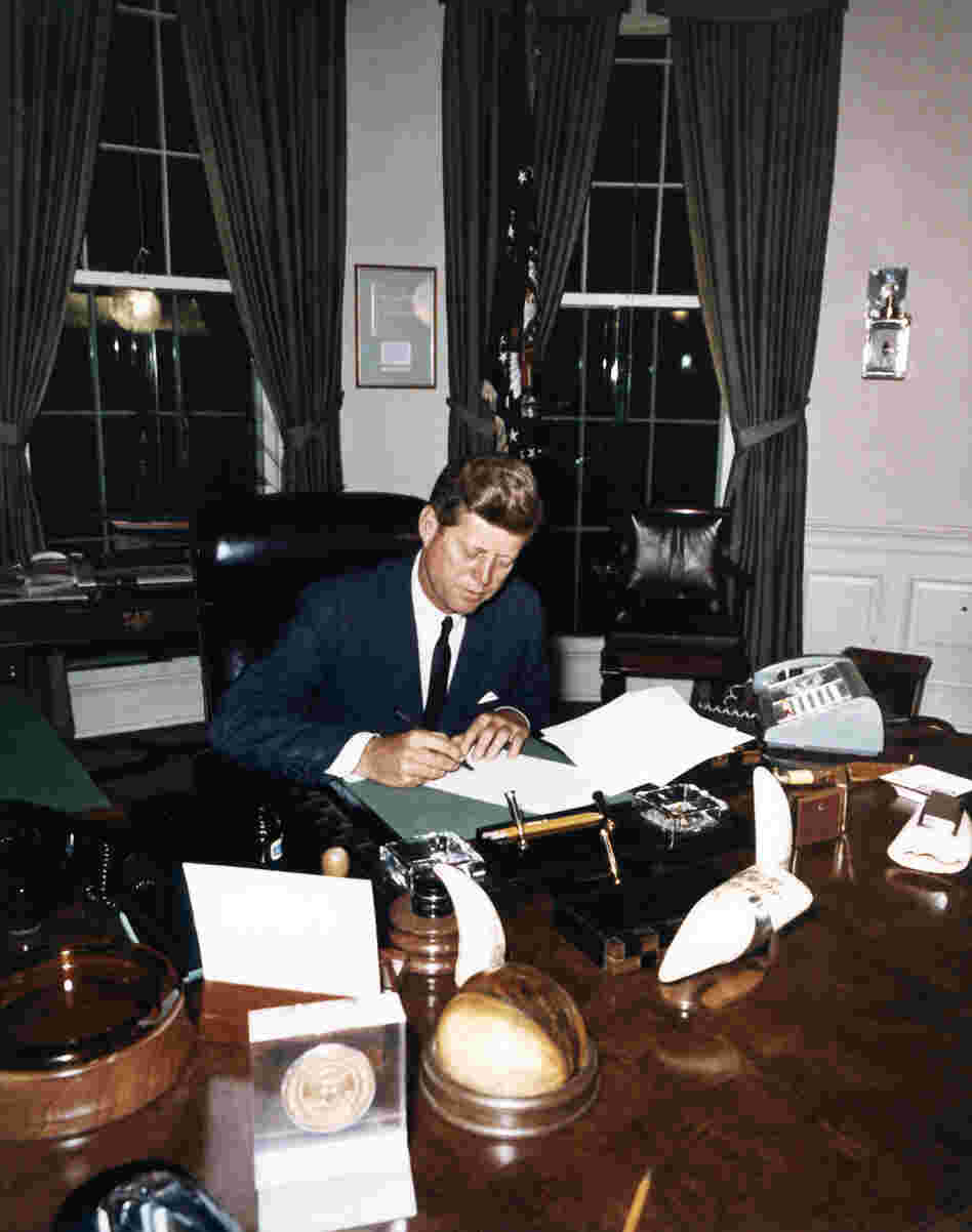 Kennedy signs the Cuba Quarantine Proclamation Oct. 23, 1962, in the Oval Office.