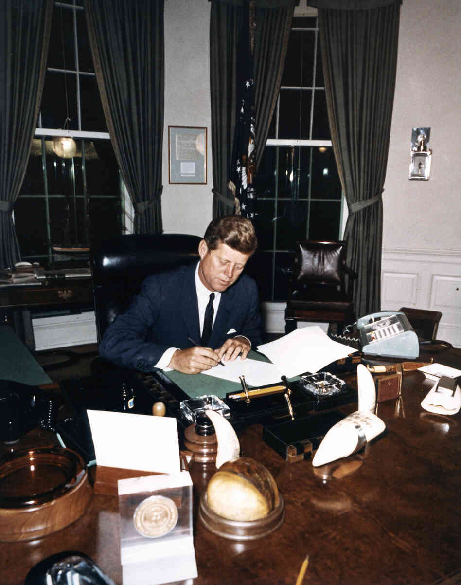 Kennedy signs the Cuba Quarantine Proclamation Oct. 23, 1962, in the Oval Office.