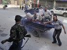 Syrians deliver an injured civilian to a hospital in the northern city of Aleppo on Saturday, following shelling by government forces. Syrians deliver an injured civilian to a hospital in the northern city of Aleppo on Saturday, following shelling by government forces.