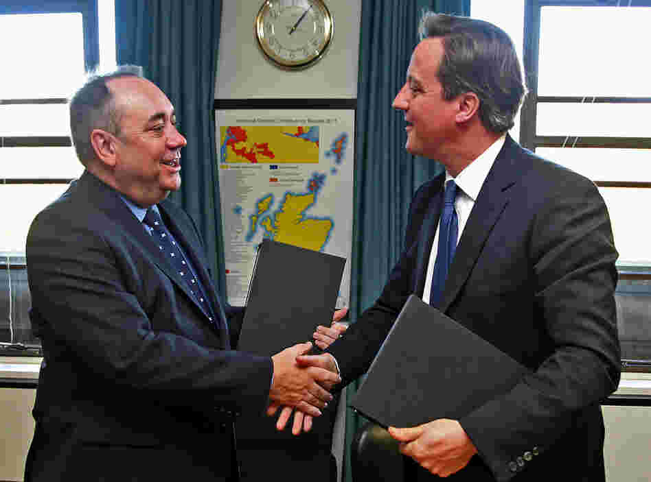 Scottish First Minister Alex Salmond and Prime Minister David Cameron shake hands after signing an Independence Referendum deal in Edinburgh, Scotland.