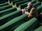 July 11, 2012: A woman cried next to the coffin of her relative at the Potocari memorial complex near Srebrenica. More than 8,000 Muslim men and boys were executed there in July 1995. It was the worst massacre in Europe since World War II. July 11, 2012: A woman cried next to the coffin of her relative at the Potocari memorial complex near Srebrenica. More than 8,000 Muslim men and boys were executed there in July 1995. It was the worst massacre in Europe since World War II.