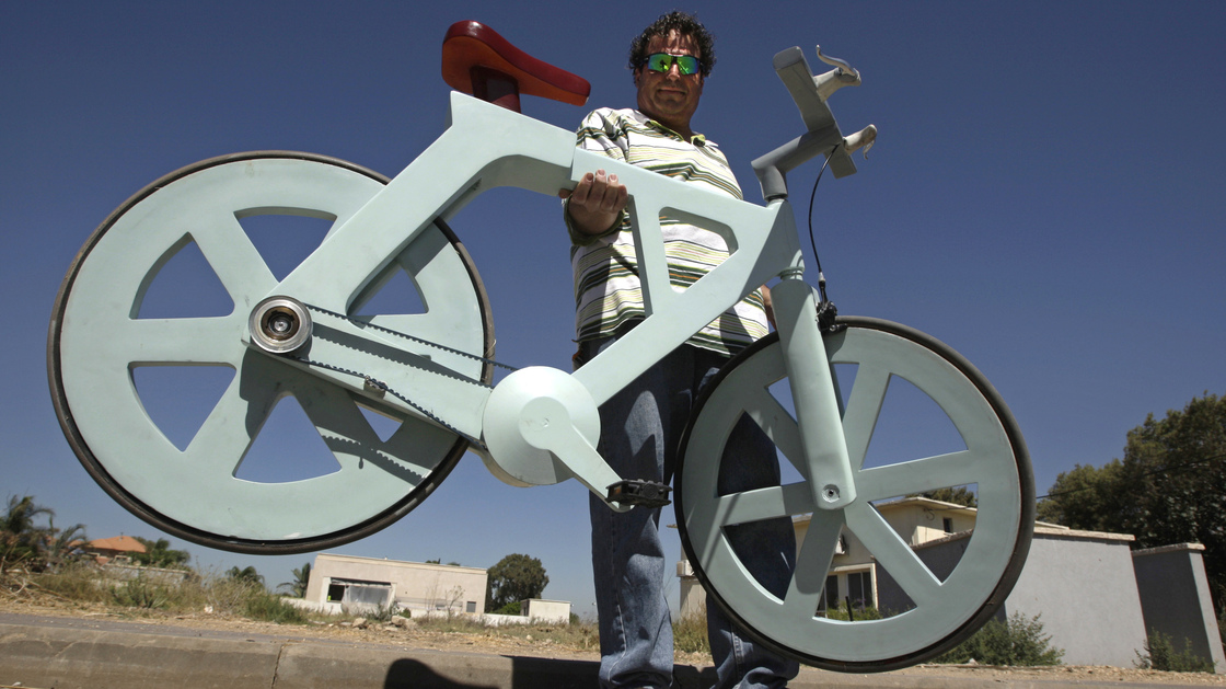Israeli inventor and his cardboard bicycle.