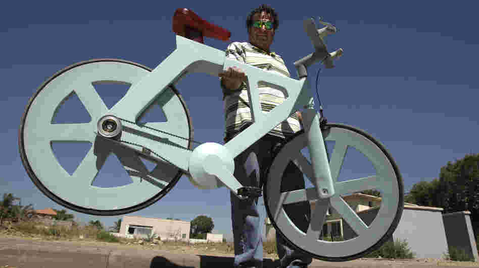 Israeli inventor and his cardboard bicycle.