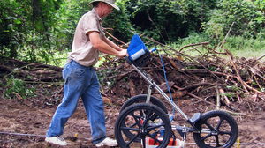 Using ground penetrating radar, archaeologist Richard Estabrook has identified dozens of previously unknown graves at the school's cemetery.