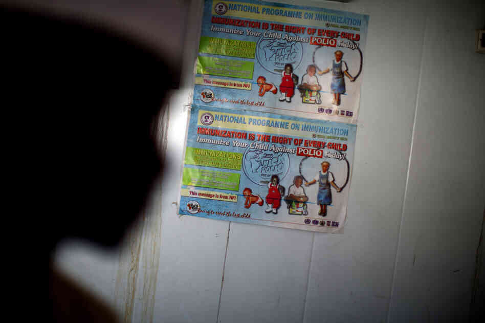 A polio immunization poster is taped on a walk-in refrigerator at a new cold storage facility at a hospital in Kano. The oral polio vaccine must be kept refrigerated; that's been a challenge in a place with only intermittent access to electricity.
