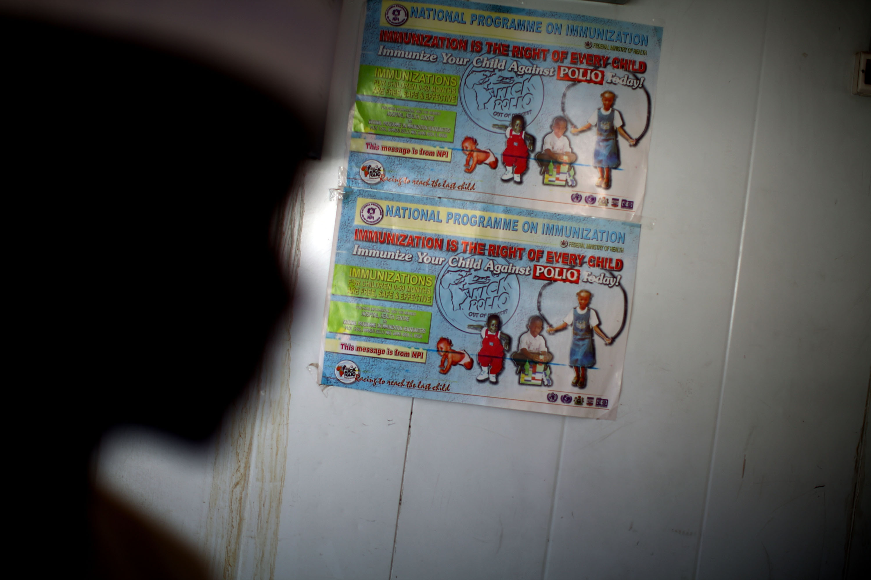 A polio immunization poster is taped on a walk-in refrigerator at a new cold storage facility at a hospital in Kano. The oral polio vaccine must be kept refrigerated; that's been a challenge in a place with only intermittent access to electricity.