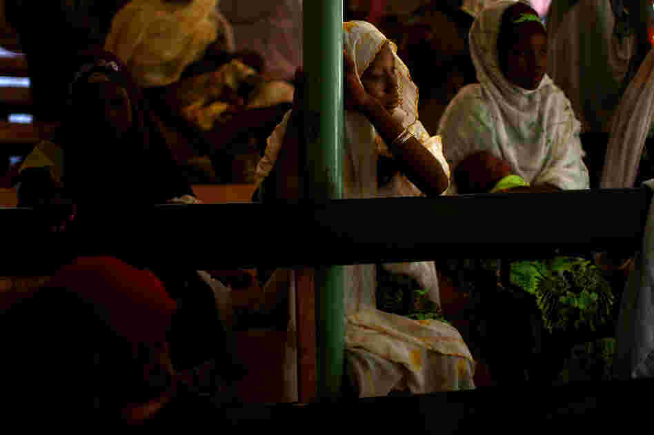 At the health clinic in Minjibir, women wait for their children to receive the polio vaccine.