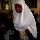 Sahya Idriss, a service provider at the health clinic in Minjibir, carries a vial of the polio vaccine. Sahya Idriss, a service provider at the health clinic in Minjibir, carries a vial of the polio vaccine.
