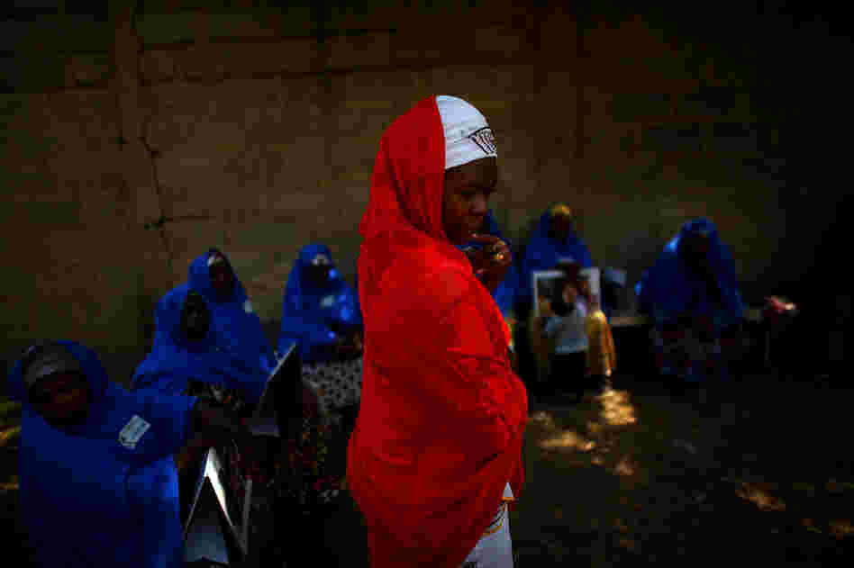 Hawa Bello, a social mobilization consultant with UNICEF in Kano, meets with community volunteers. The volunteers are given a small stipend to guide polio immunization teams through their individual neighborhoods. It's the volunteer's job to make sure every child under 5 in a given neighborhood gets vaccinated.