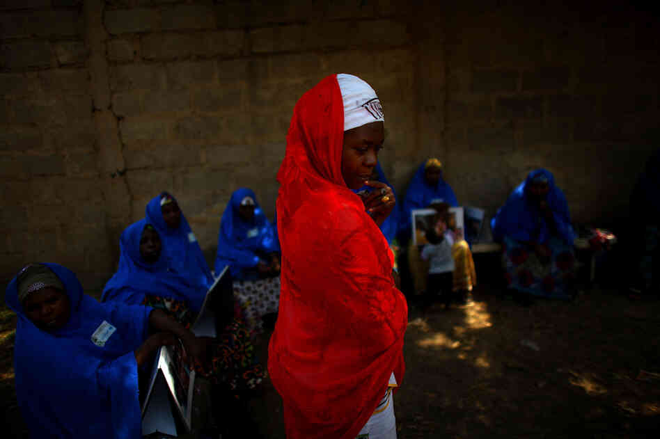 Hawa Bello, a social mobilization consultant with UNICEF in Kano, meets with community volunteers. The volunteers are given a small stipend to guide polio immunization teams through their individual neighborhoods. It's the volunteer's job to make sure every child under 5 in a given neighborhood gets vaccinated.