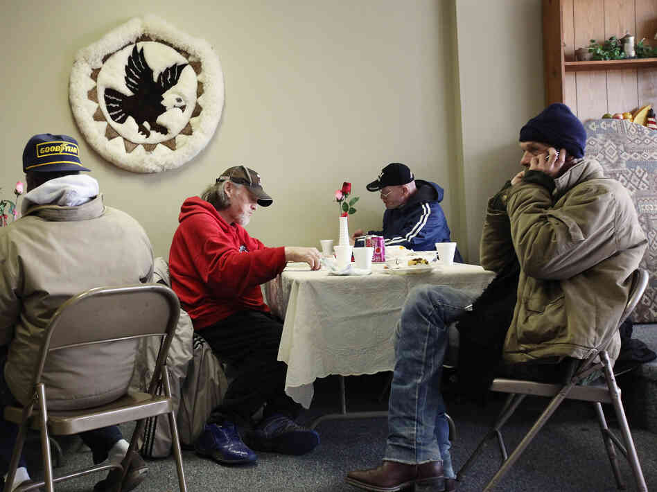 People eat a free community meal at The Center in Lima, Ohio, earlier this year. Although more than 46 million Americans are poor, the issue has gotten little attention in the presidential race.