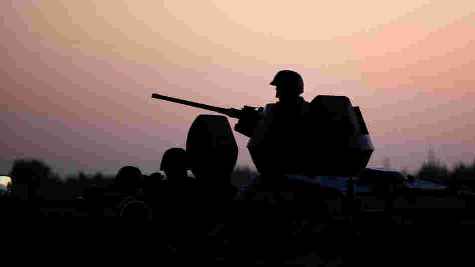 Turkish soldiers stand near the Turkey-Syria border in Akcakale, Turkey, early Friday. Turkish soldiers stand near the Turkey-Syria border in Akcakale, Turkey, early Friday.