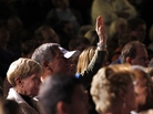 An audience member holds up his hand at a Mitt Romney town hall meeting in Dayton, Ohio, in March. Audience members will be allowed to ask questions at the second presidential debate, being held Tuesday night in Hempstead, N.Y. An audience member holds up his hand at a Mitt Romney town hall meeting in Dayton, Ohio, in March. Audience members will be allowed to ask questions at the second presidential debate, being held Tuesday night in Hempstead, N.Y.