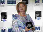 Hilary Mantel, winner of the Man Booker Prize for Fiction, poses with her prize shortly after the award ceremony in London Tuesday. Mantel, won the 50,000 British pounds (approximately $80,000) prize with her book Bring up the Bodies. Hilary Mantel, winner of the Man Booker Prize for Fiction, poses with her prize shortly after the award ceremony in London Tuesday. Mantel, won the 50,000 British pounds (approximately $80,000) prize with her book Bring up the Bodies.