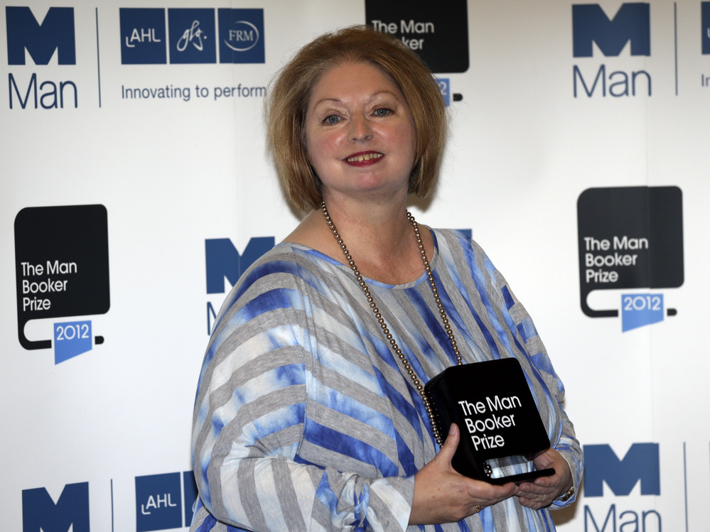 Hilary Mantel, winner of the Man Booker Prize for Fiction, poses with her prize shortly after the award ceremony in London Tuesday. Mantel, won the 50,000 British pounds (approximately $80,000) prize with her book Bring up the Bodies.