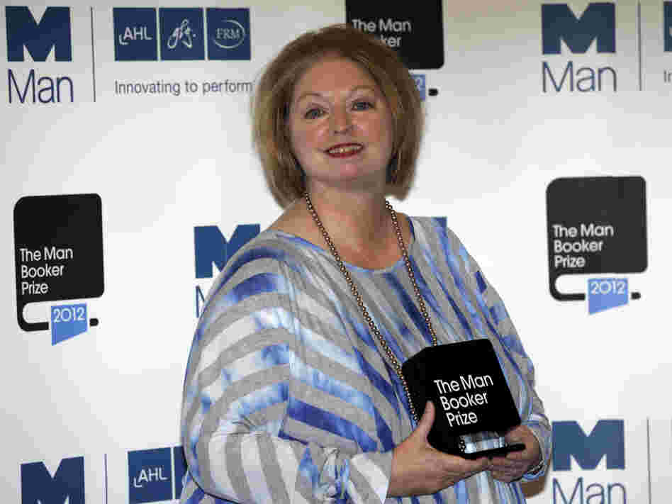 Hilary Mantel, winner of the Man Booker Prize for Fiction, poses with her prize shortly after the award ceremony in London Tuesday. Mantel, won the 50,000 British pounds (approximately $80,000) prize with her book Bring up the Bodies.