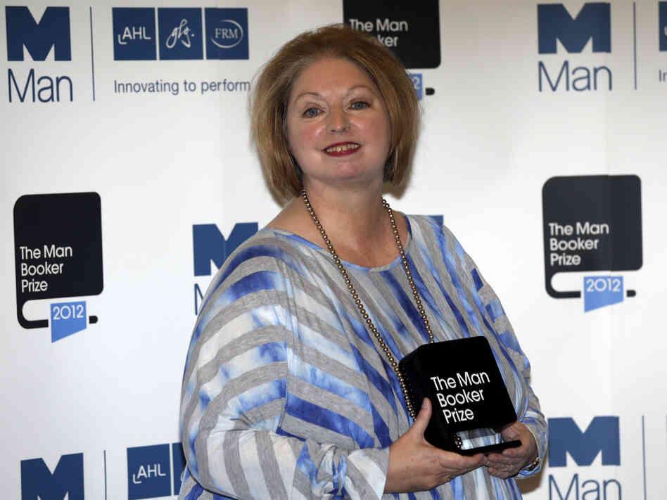 Hilary Mantel, winner of the Man Booker Prize for Fiction, poses with her prize shortly after the award ceremony in London Tuesday. Mantel, won the 50,000 British pounds (approximately $80,000) prize with her book Bring up the Bodies.