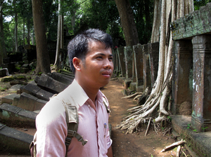 Archaeologist Phin Samnang, 29, surveys the ruins of Prasat Chen temple at Koh Ker. He says that unlike in earlier periods, Cambodia now has the means and duty to reclaim its priceless lost antiquities.